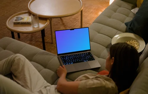 Woman looking at MacBook Pro mockup