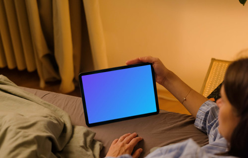 Woman watching on an iPad Air mockup