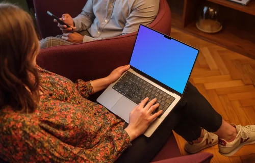 Woman working on a MacBook Pro 14 mockup in the office