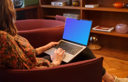 Woman working on the MacBook Pro mockup in office environment
