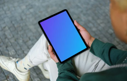 Young man reading on tablet mockup