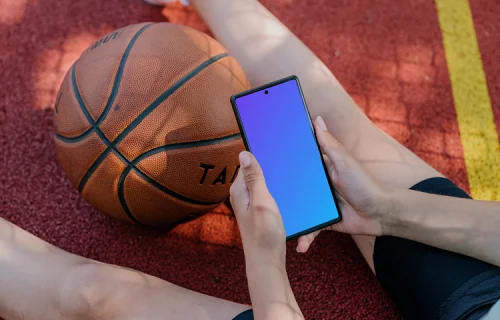 Basketball player checking on a Google Pixel mockup