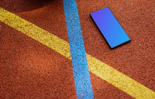 Basketball player standing next to a Google Pixel 6 mockup