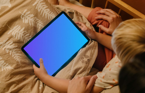 Boy's hands holding an iPad Air mockup