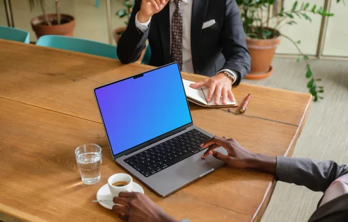 Business meeting and MacBook Pro 14 mockup