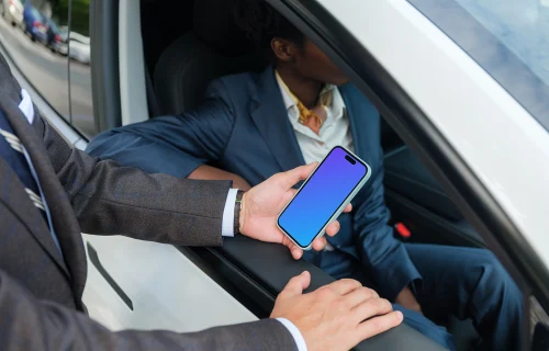 Businessman holding a iPhone 14 Pro mockup