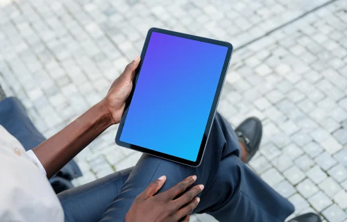 Businesswoman thriving outdoors with iPad Air in her hand