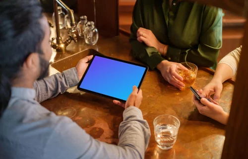 Colleagues in the lounge with iPad mockup
