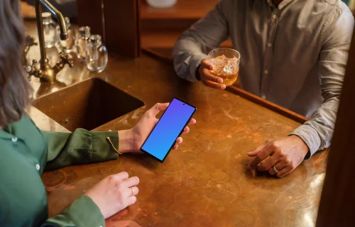 Cozy lounge and woman holding a phone mockup