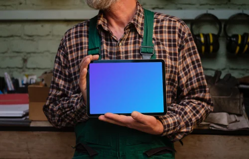 Crafter holding an iPad Air mockup