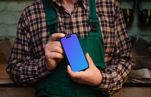 Crafter holding an iPhone 14 Pro mockup