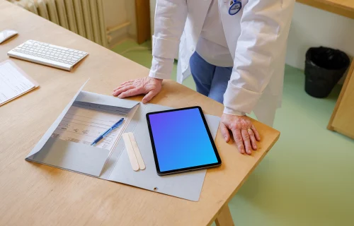 Doctor standing next to the iPad mockup