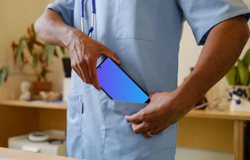 Doctor taking phone to the pocket