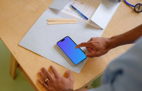 Doctor typing on the iPhone mockup