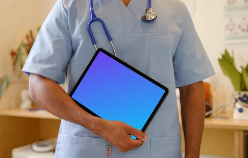Doctor’s hand holding an iPad mockup