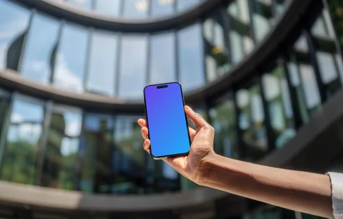 Entrepreneur holding a iPhone mockup in her hand