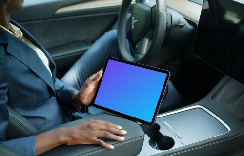 Entrepreneur holding an iPad Air mockup in Tesla