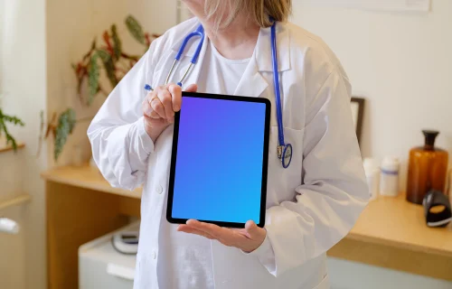 Female doctor holding an iPad Air mockup