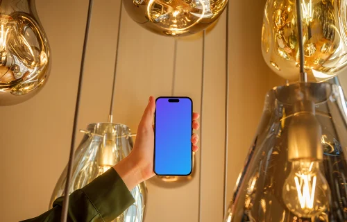 Female hand holding a iPhone in the lounge