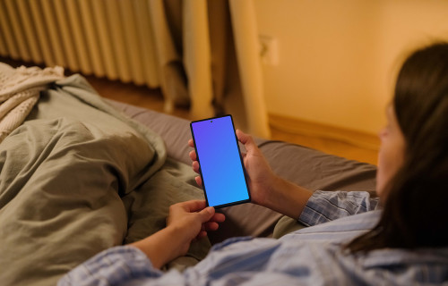 Female hand holding a phone mockup