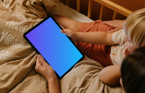 Female hand holding a tablet mockup