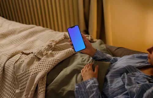 Female hand holding an iPhone mockup