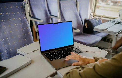 Female hand scrolling on a MacBook Pro 14 mockup