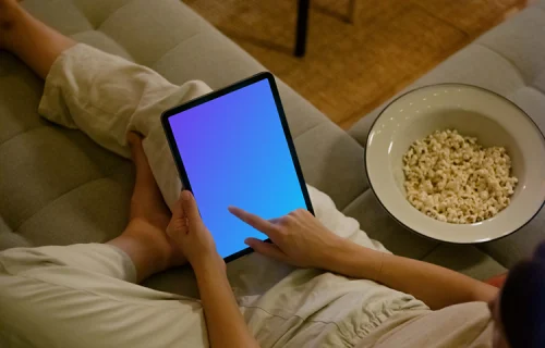 Female hand typing on an iPad Air mockup