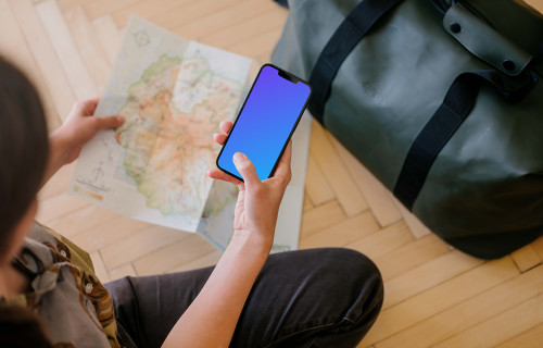 Female hand typing on an iPhone 13 mockup