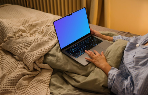 Female hand working on a MacBook Pro 14 mockup