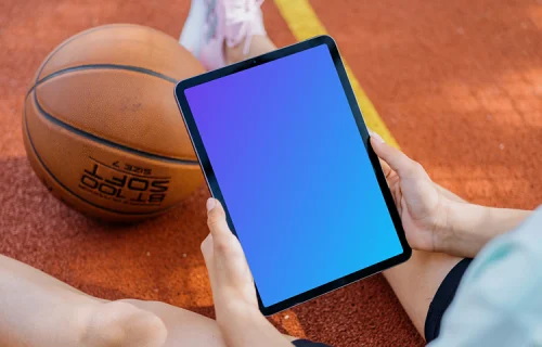 Female hands holding a tablet mockup