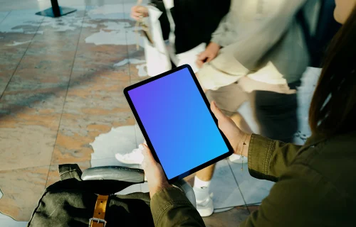 Female hands holding an iPad Air mockup