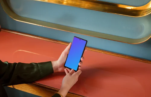 Female holding a Google Pixel mockup in the office