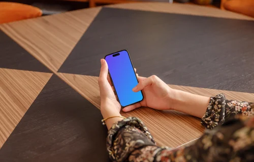 Female holding a iPhone mockup in the office