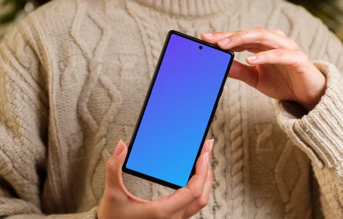 Female holding a phone mockup in Christmas theme