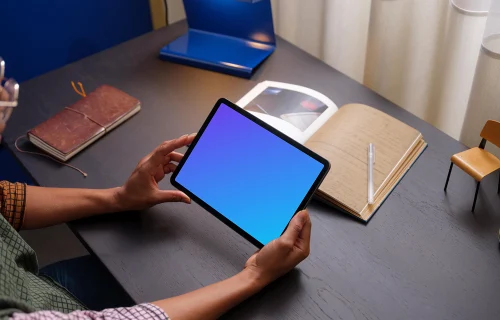 Female holding an iPad Air mockup