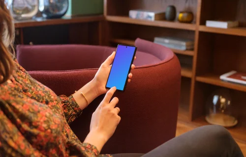 Female working on a Google Pixel mockup in a lounge area