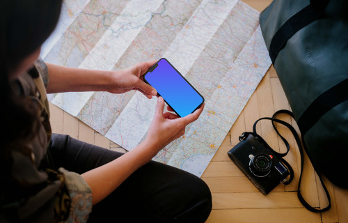 Female working on an iPhone 13 mockup