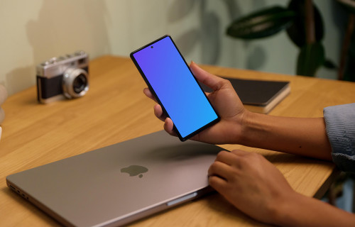 Hand holding a Google Pixel 6 mockup