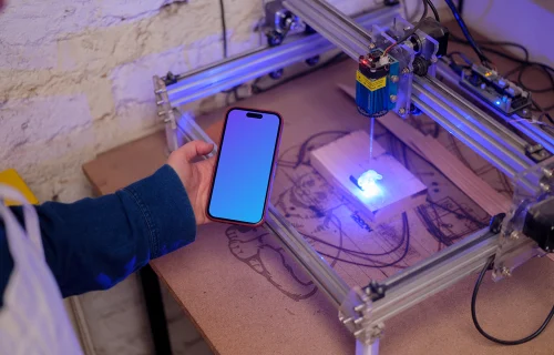 Hand holding an iPhone 14 Pro mockup