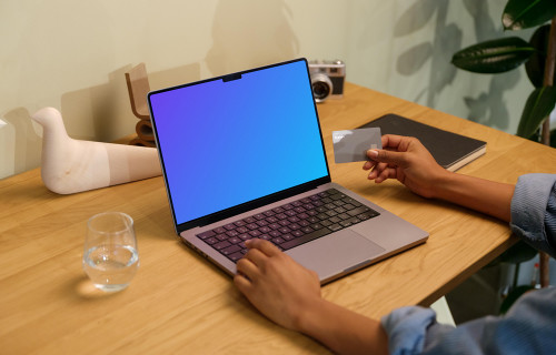 Hand typing on a MacBook Pro mockup