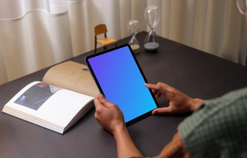 Hands holding an iPad Air mockup