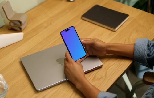 Hands holding an iPhone 14 Pro mockup