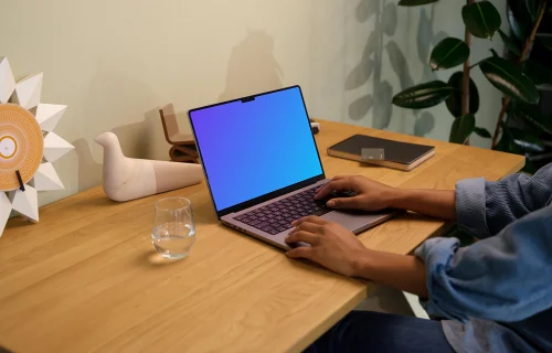 Hands typing on a MacBook Pro 14 mockup