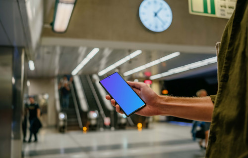 Holding a Google Pixel 6 mockup at the subway station