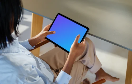 iPad Air mockup in female hand at modern home