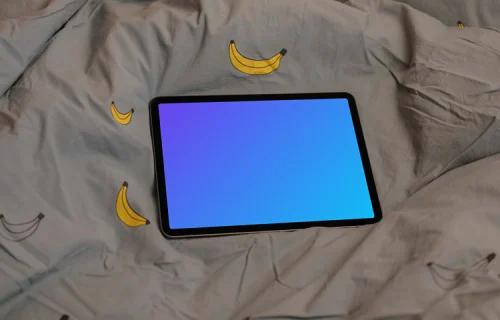 iPad Air mockup on bed sheets