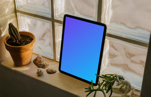iPad Air mockup placed against a glass window