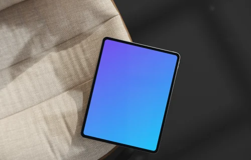 iPad Pro mockup on a modern fabric chair
