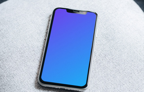 iPhone 11 mockup on pillow